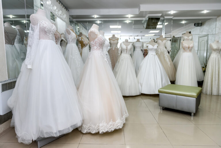 interior of bridal salon, wedding dresses on mannequins